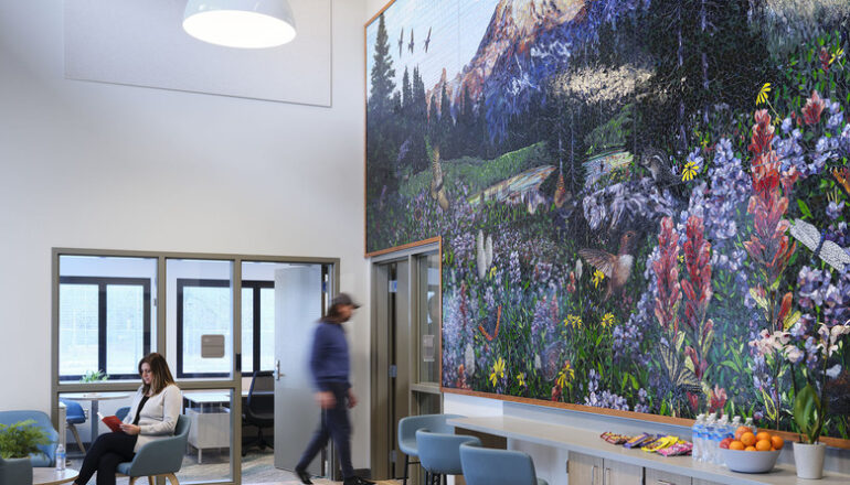 People enjoy a floor to ceiling nature mosaic in the Maple Lane facility.